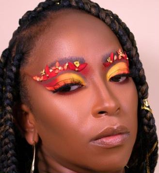Carnival make-up with a red and orange eye design